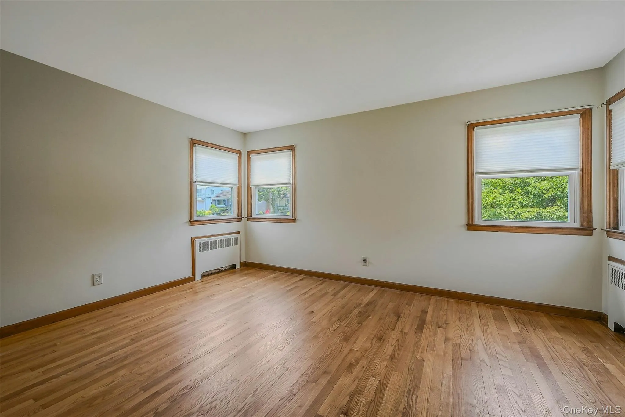 Primary Bedroom w/ Hardwood Floors Primary Bedroom w/ Hardwood Floors
