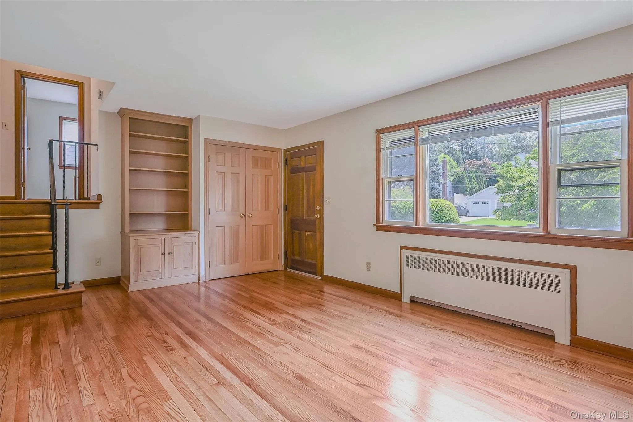 Front Entry with Coat Closet and Built In Bookcase Front Entry with Coat Closet and Built In Bookcase