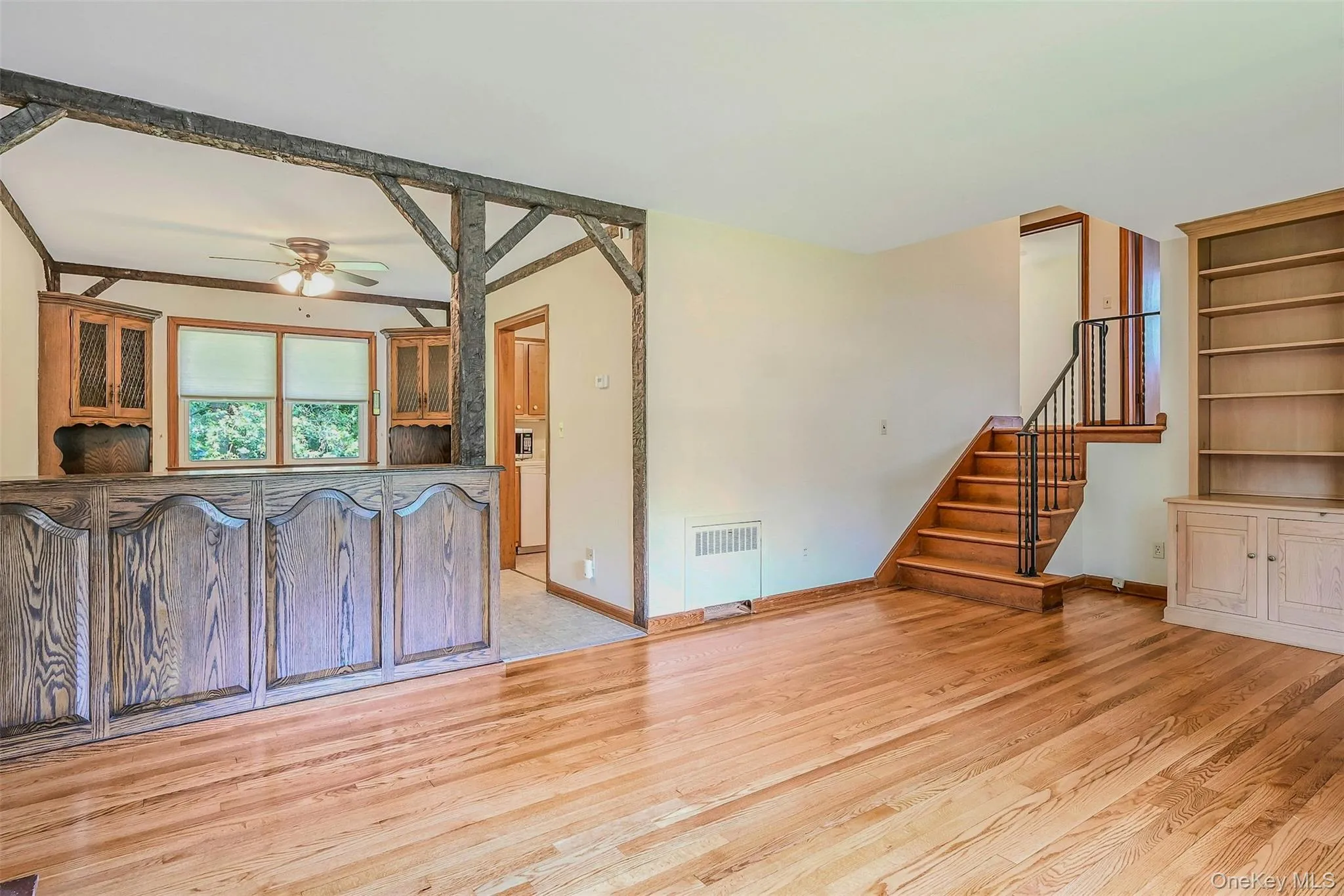 Living Room View to Dining Room and Upstairs Living Room View to Dining Room and Upstairs