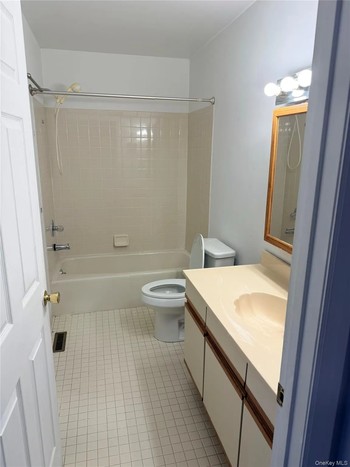 Full bath with vanity, shower / bathtub combination, and light tile patterned floors Full bath with vanity, shower / bathtub combination, and light tile patterned floors