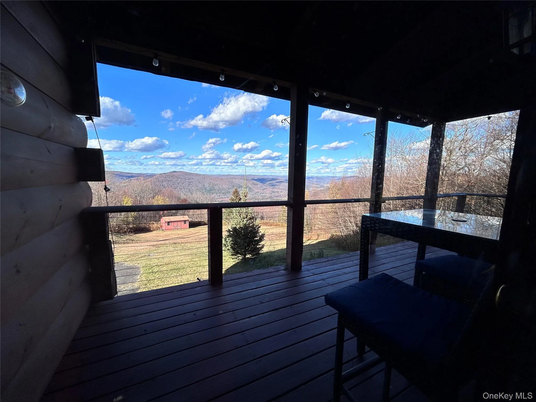 Deck featuring a mountain view Deck featuring a mountain view