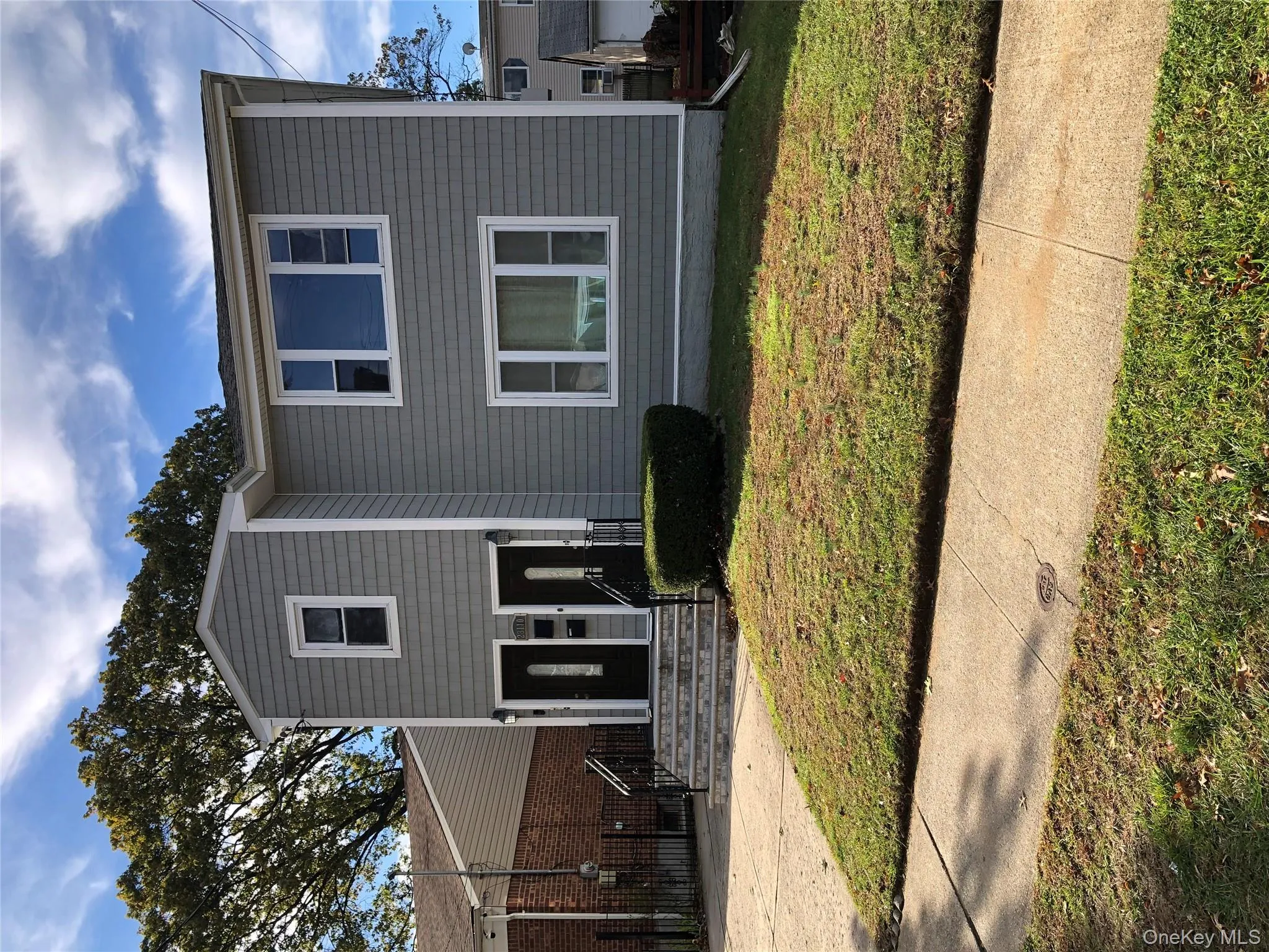 Traditional-style home with a front lawn Traditional-style home with a front lawn
