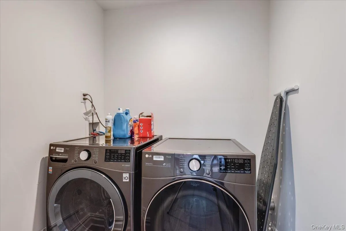 Laundry room featuring washer and dryer Laundry room featuring washer and dryer