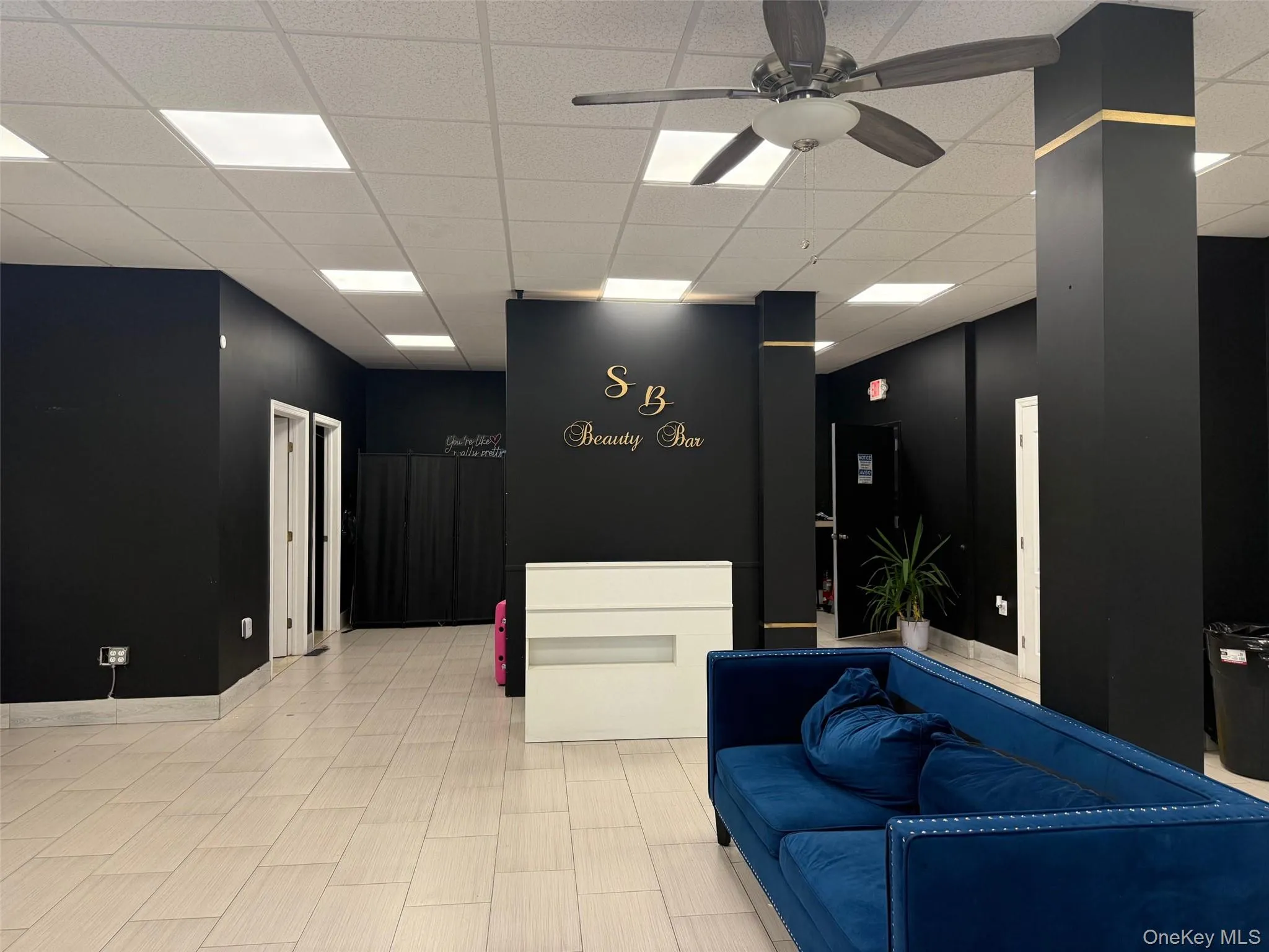 Welcome open area with a drop ceiling and ceiling fan Welcome open area with a drop ceiling and ceiling fan