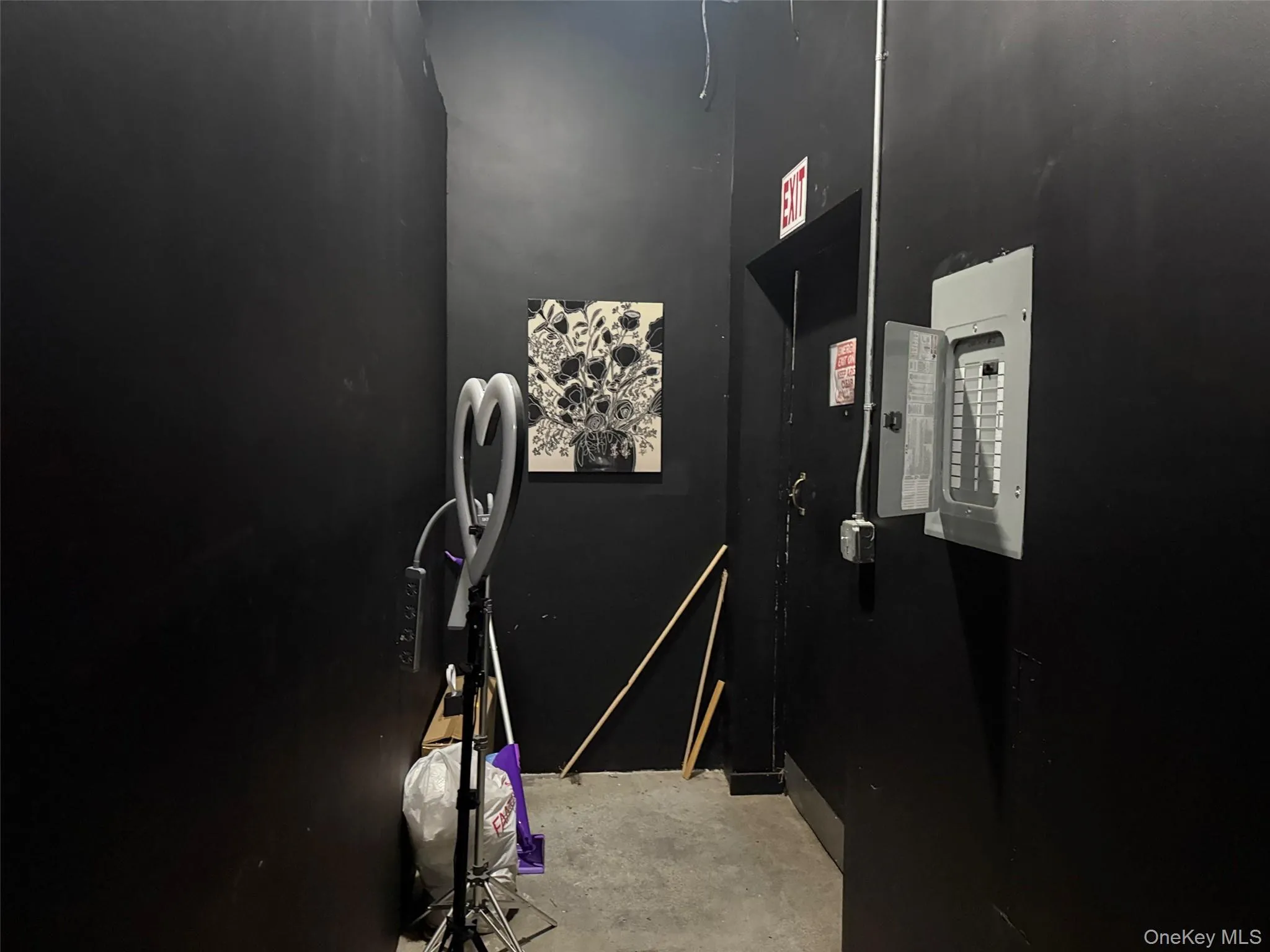 Utility room featuring electric panel Utility room featuring electric panel