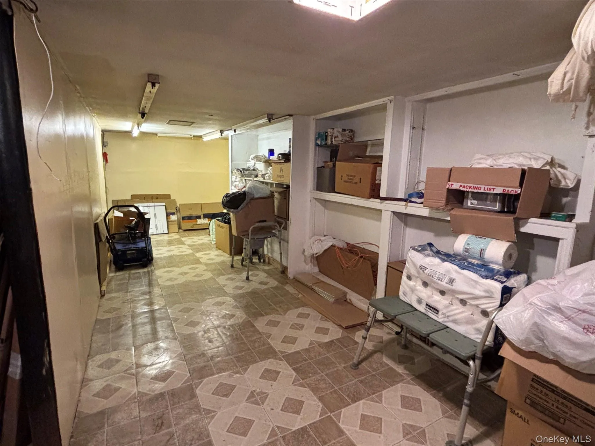 Unfinished below grade area featuring light floors Unfinished below grade area featuring light floors