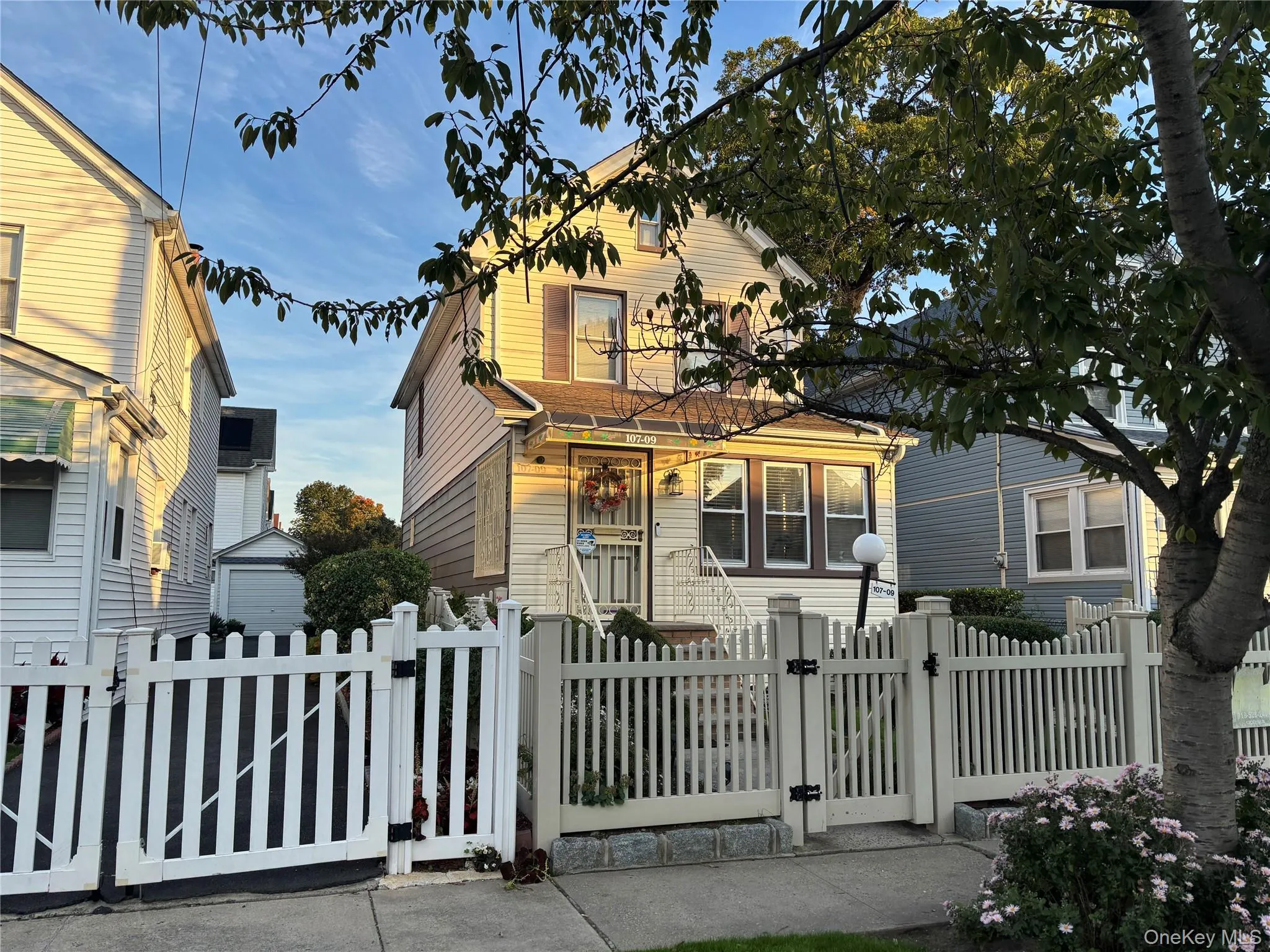 View of front facade featuring a gate and a fenced front yard View of front facade featuring a gate and a fenced front yard