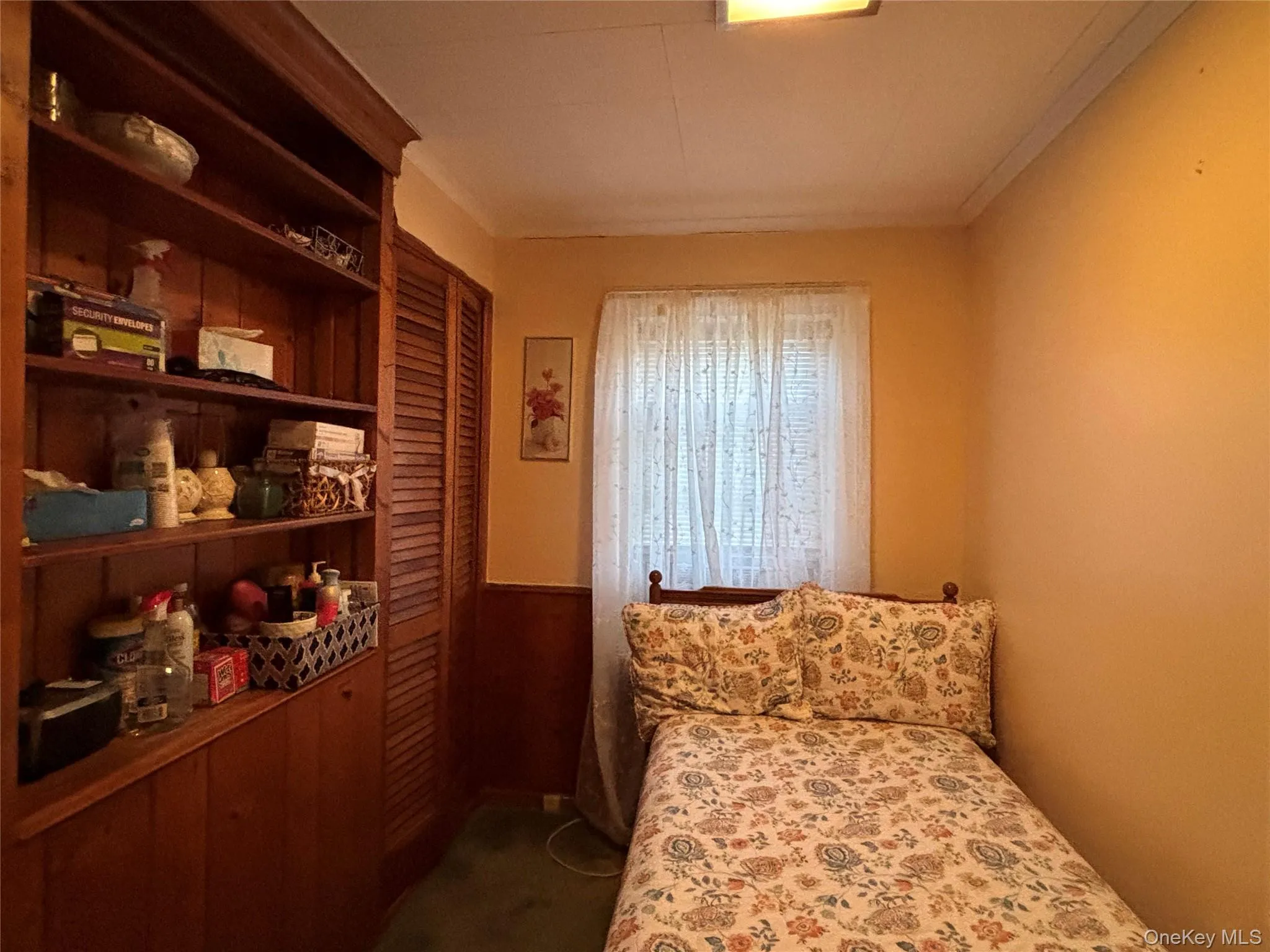 Bedroom featuring dark colored carpet Bedroom featuring dark colored carpet