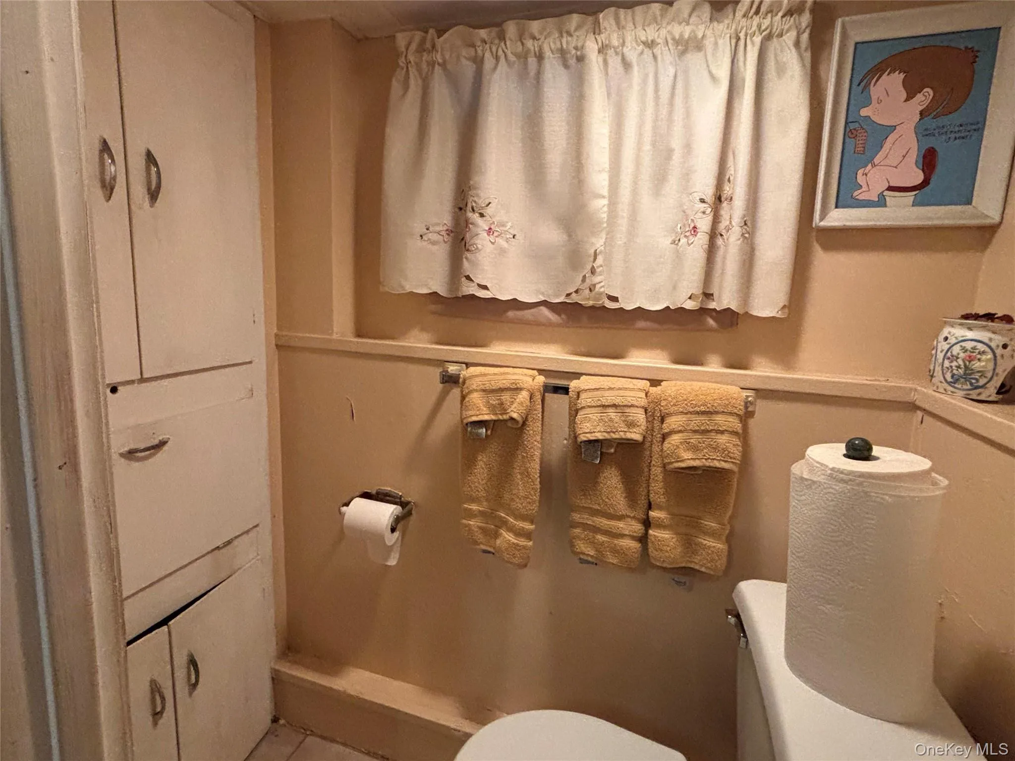 Half bathroom featuring toilet Half bathroom featuring toilet