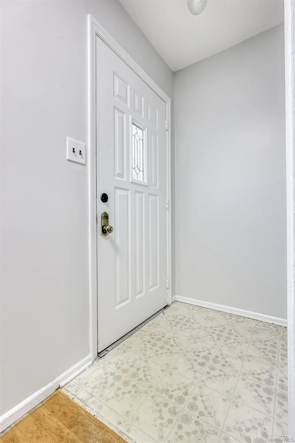 Foyer entrance with baseboards and closet Foyer entrance with baseboards and closet