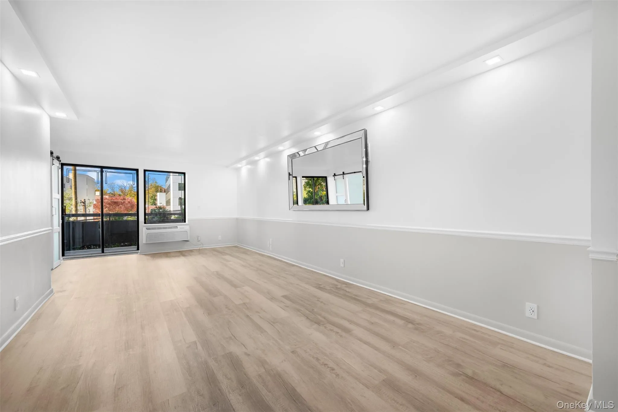 Living Room/Dining Room Featuring Light Wood Floors Living Room/Dining Room Featuring Light Wood Floors