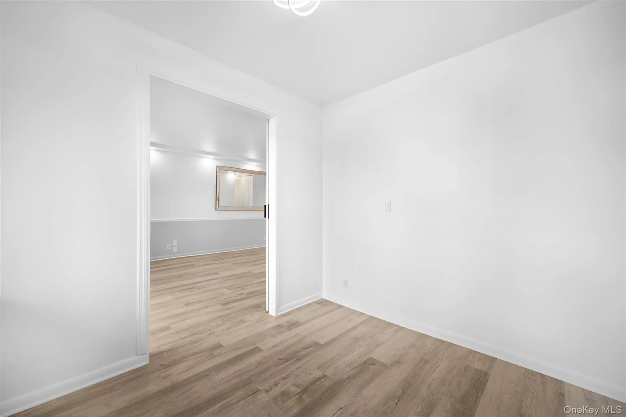 Bedroom featuring light wood-style floors Bedroom featuring light wood-style floors