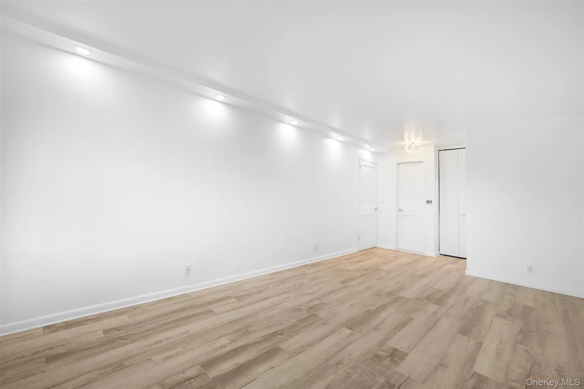 Primary Bedroom featuring wood finished floors Primary Bedroom featuring wood finished floors