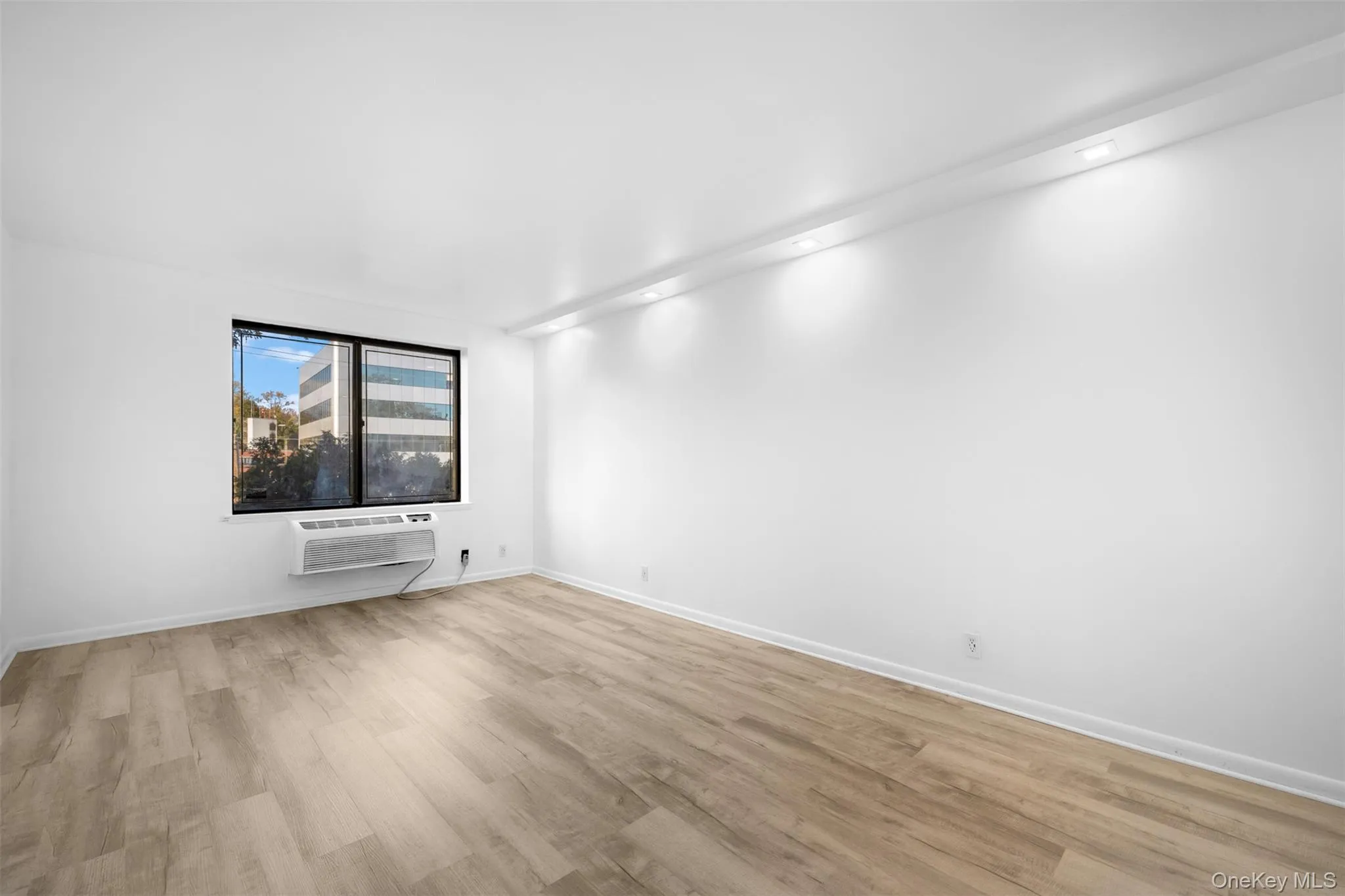 Primary Bedroom featuring light wood-type flooring Primary Bedroom featuring light wood-type flooring