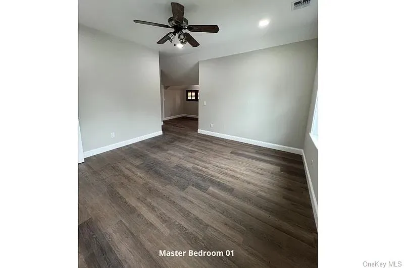 Spare room featuring dark wood-style floors, recessed lighting, and a ceiling fan Spare room featuring dark wood-style floors, recessed lighting, and a ceiling fan