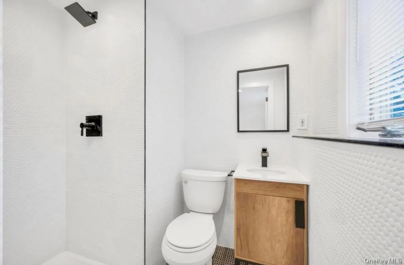 Bathroom with walk in shower and vanity Bathroom with walk in shower and vanity