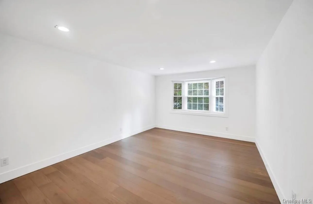 Unfurnished room featuring dark wood finished floors and recessed lighting Unfurnished room featuring dark wood finished floors and recessed lighting