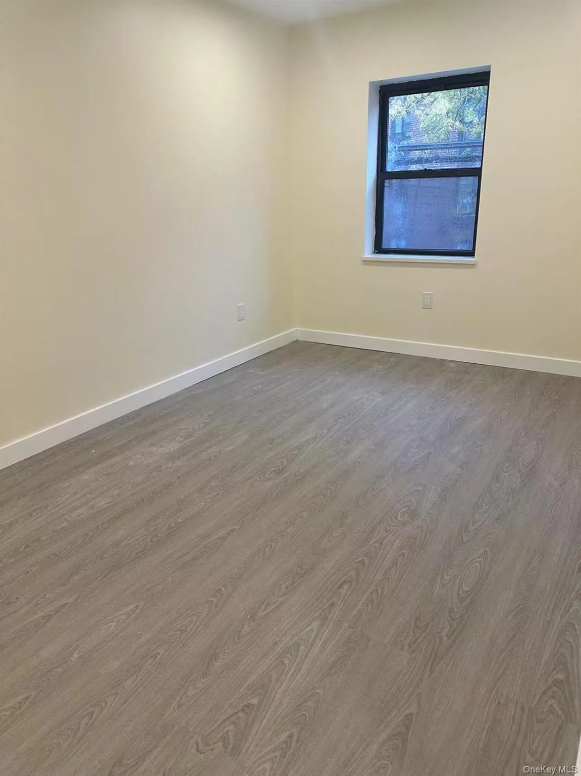 Empty room featuring light wood-style flooring and baseboards Empty room featuring light wood-style flooring and baseboards