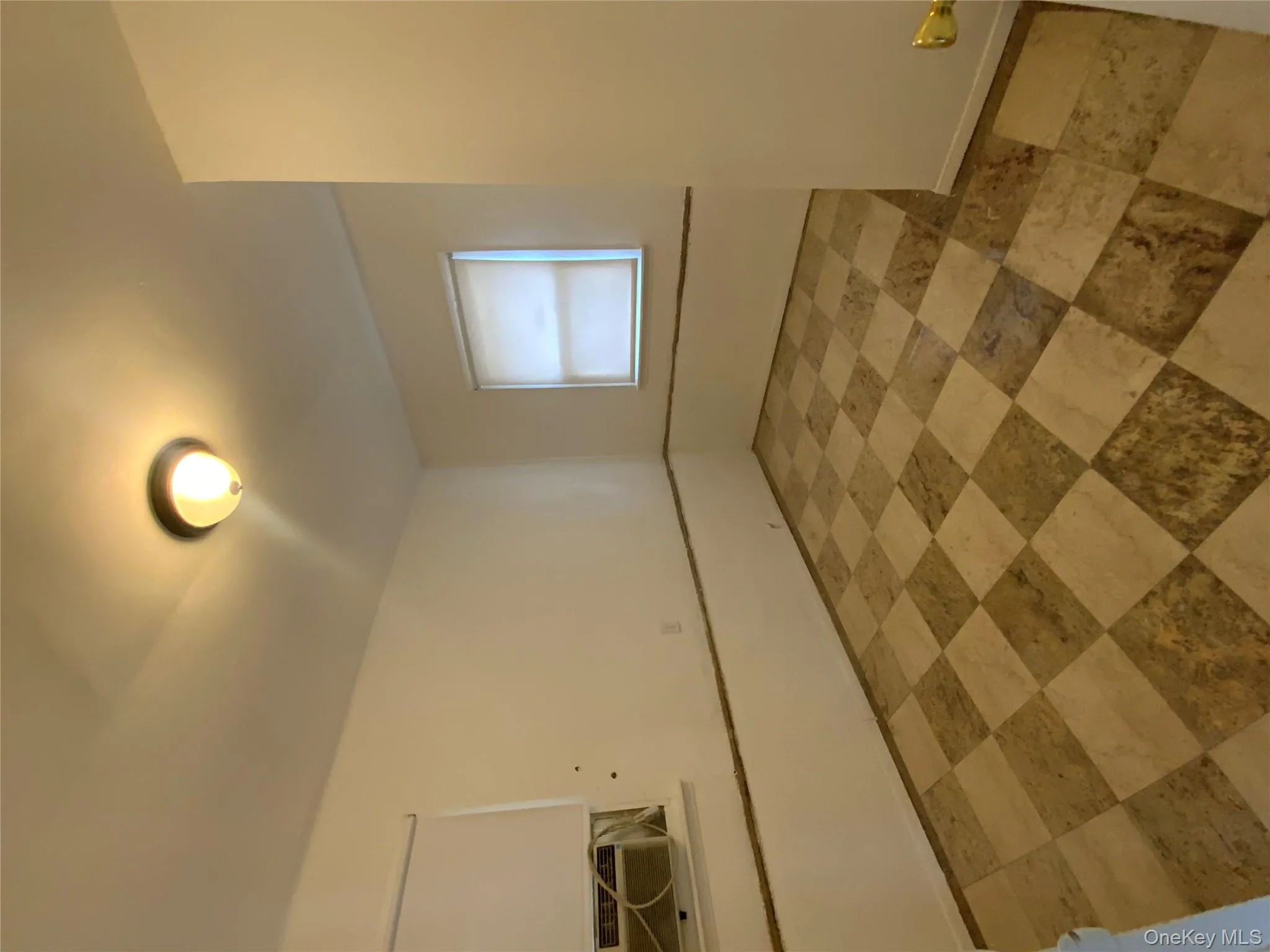 Unfurnished room featuring baseboards and light flooring Unfurnished room featuring baseboards and light flooring