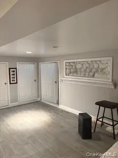 Unfurnished bedroom with light wood-style flooring and baseboards Unfurnished bedroom with light wood-style flooring and baseboards