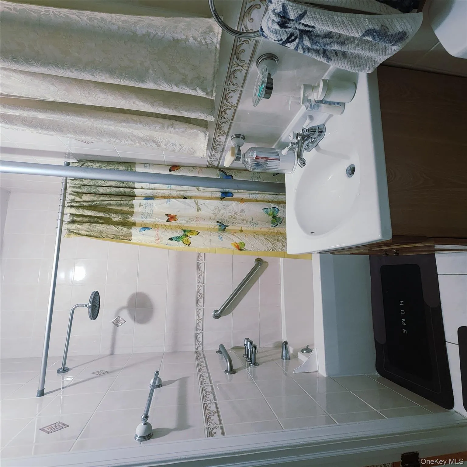 Full bathroom with vanity and shower / bath combination with curtain Full bathroom with vanity and shower / bath combination with curtain