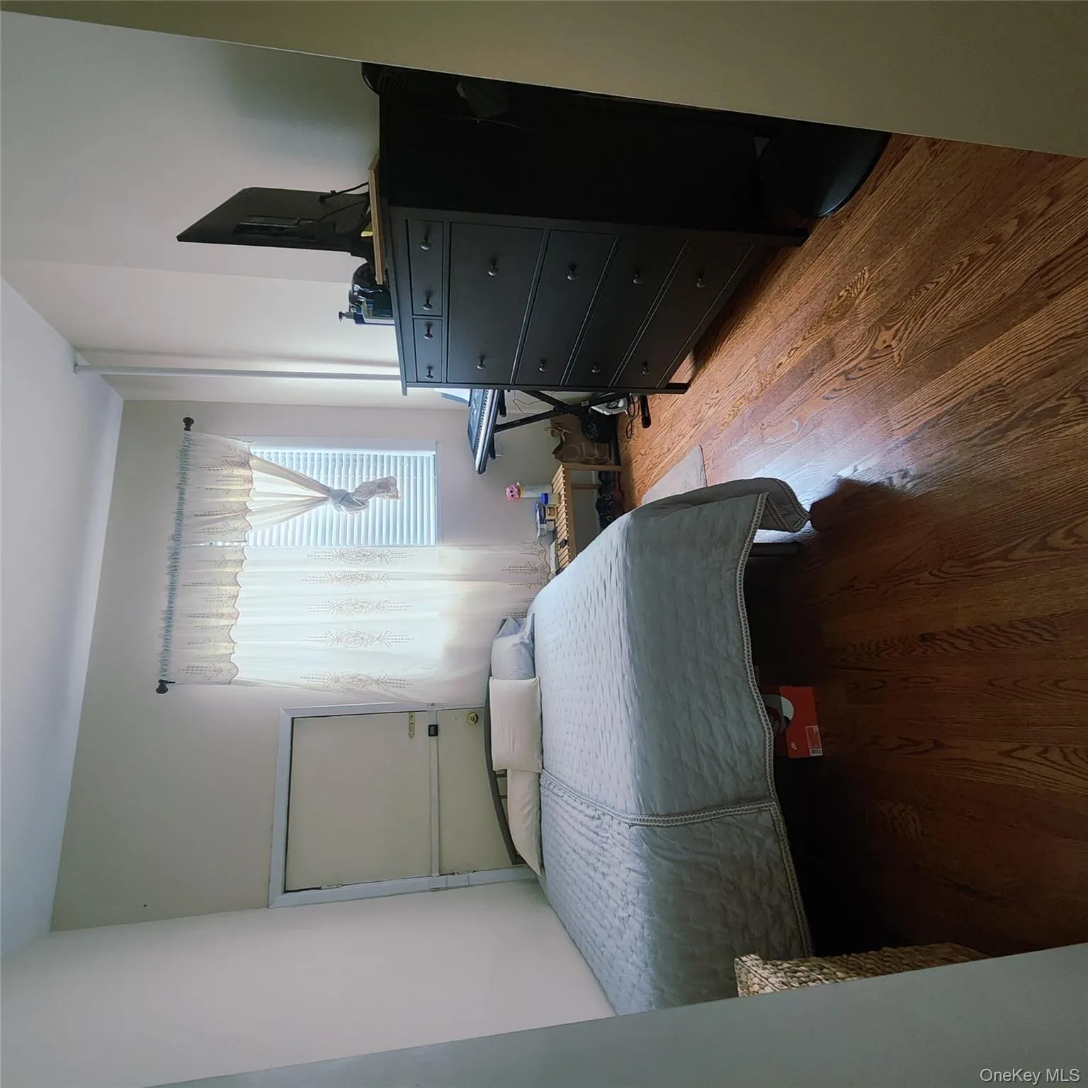 Bedroom with wood finished floors Bedroom with wood finished floors