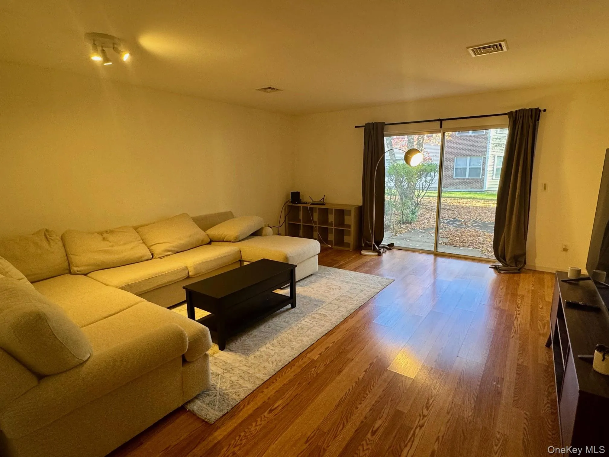 Living area with light wood-style flooring Living area with light wood-style flooring