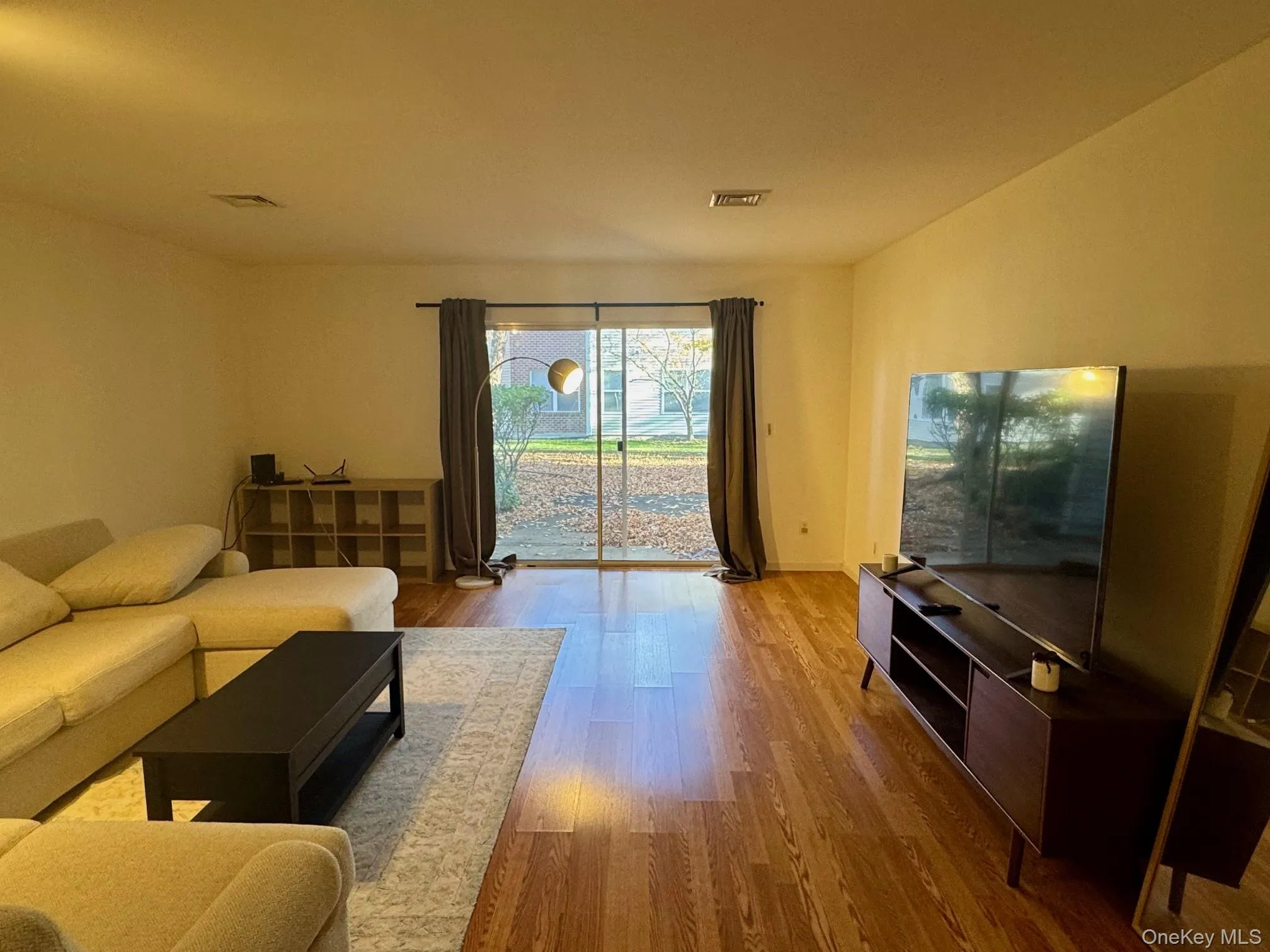 Living area with wood finished floors Living area with wood finished floors