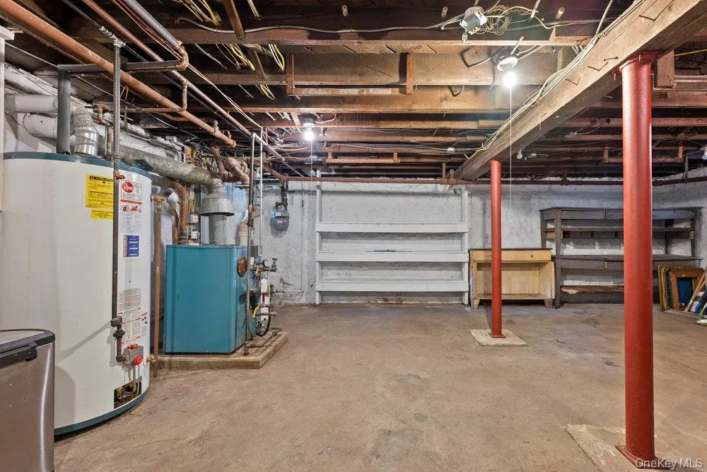 Unfinished basement featuring water heater and gas meter Unfinished basement featuring water heater and gas meter