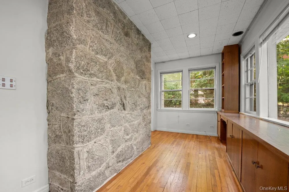 Empty room featuring baseboards and light wood-style floors Empty room featuring baseboards and light wood-style floors