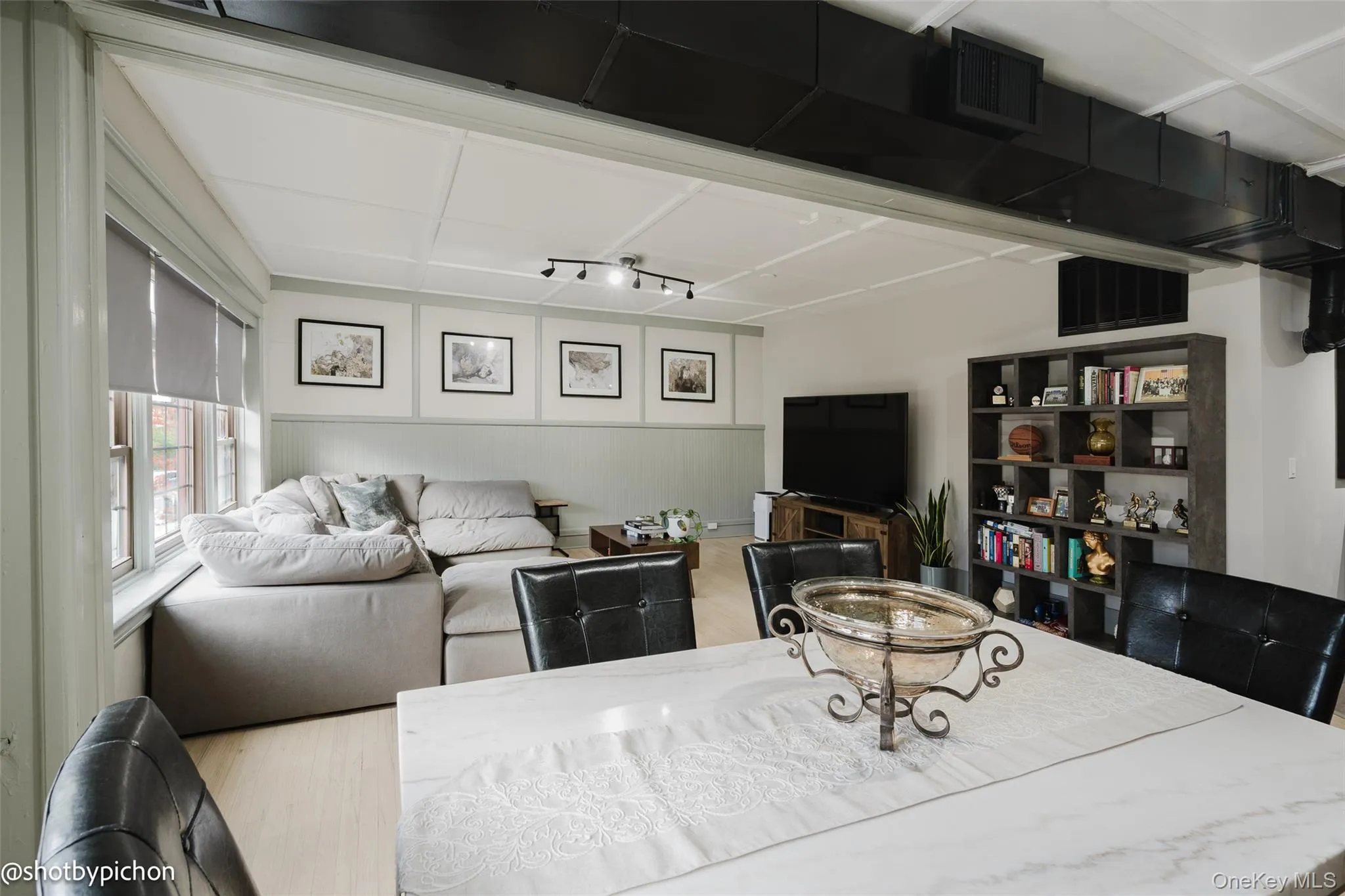 Living area featuring wood finished floors Living area featuring wood finished floors