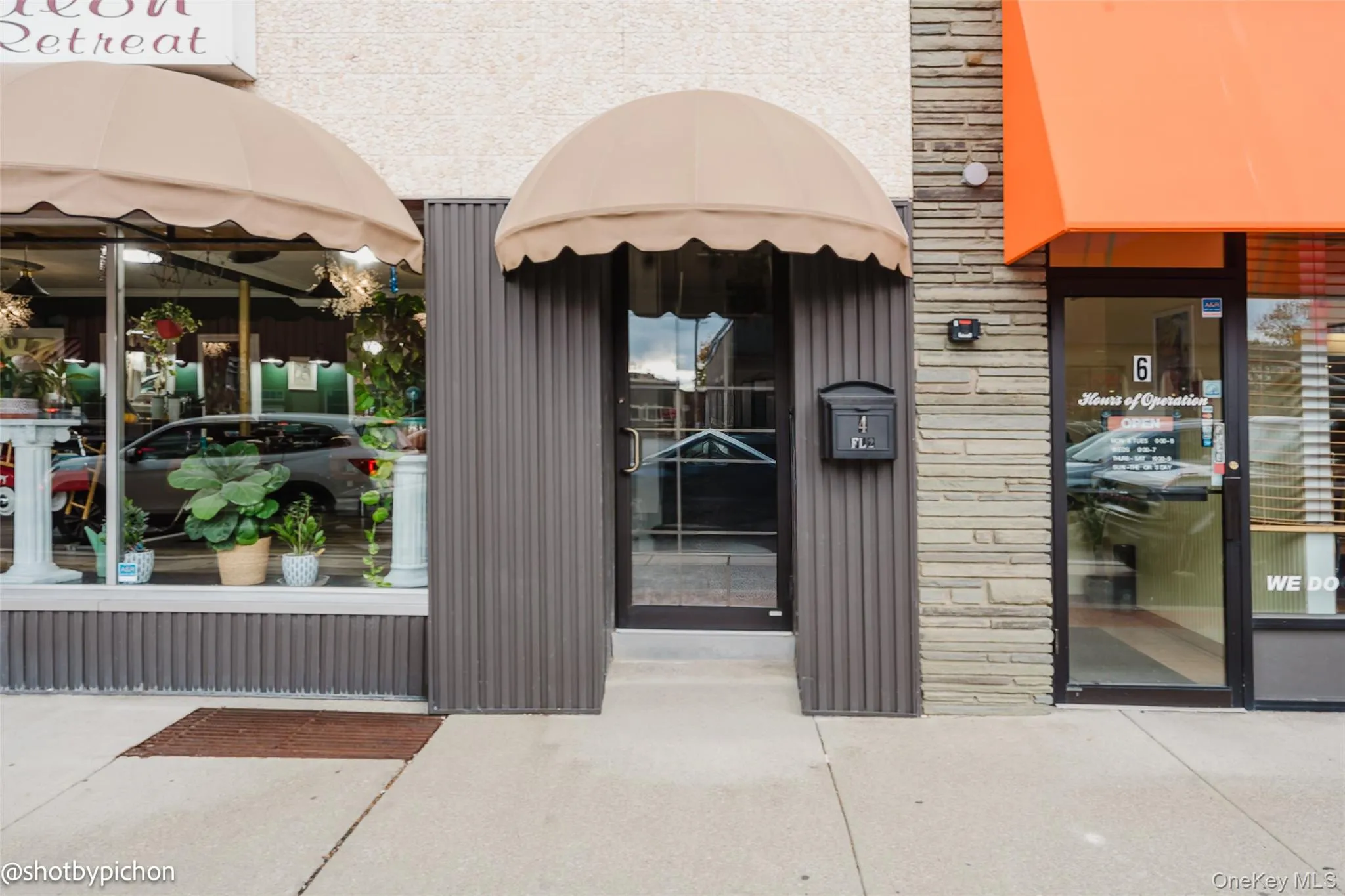 Doorway to property featuring stone siding Doorway to property featuring stone siding