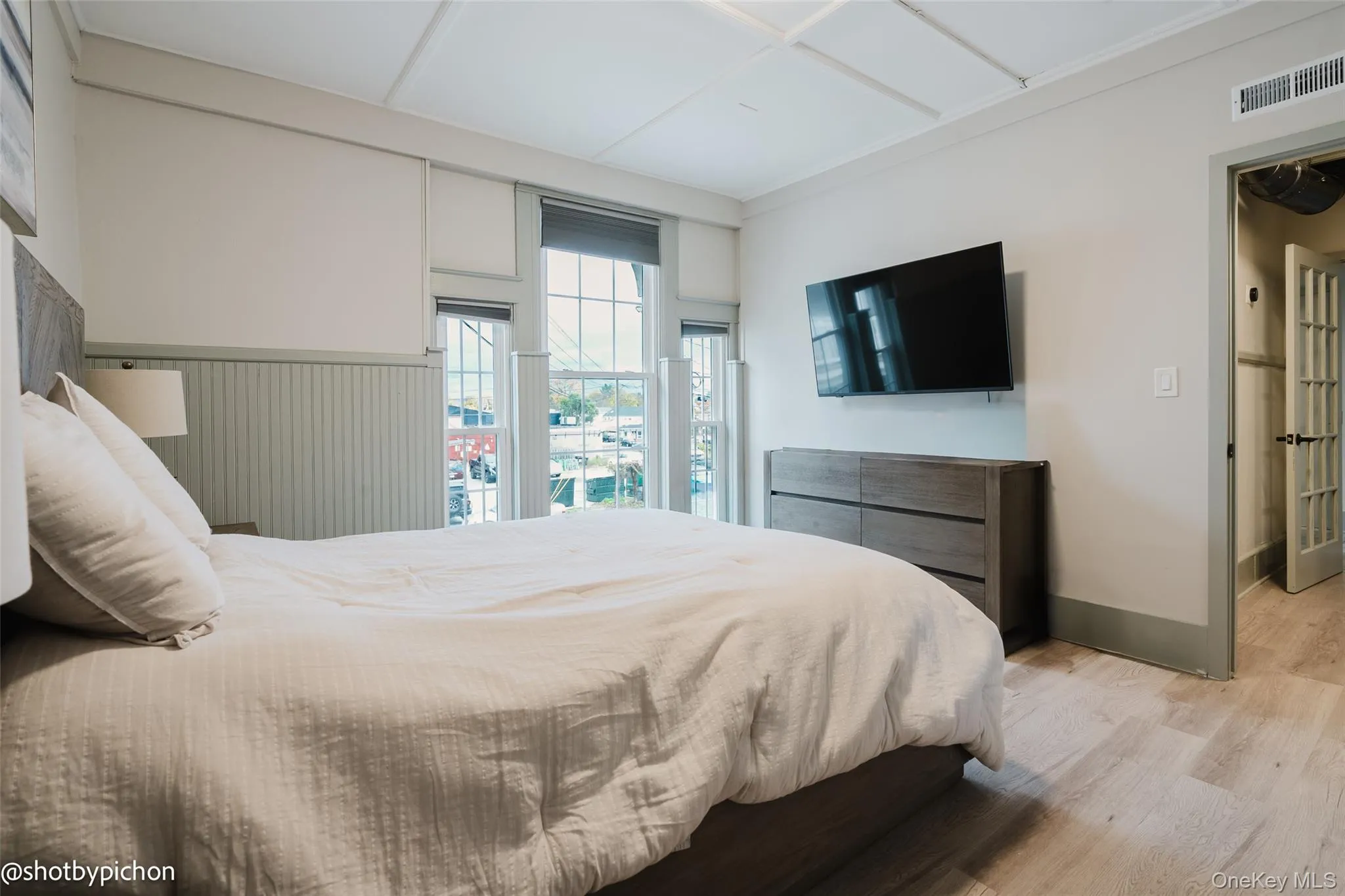 Primary Bedroom featuring wood finished floors and baseboards Primary Bedroom featuring wood finished floors and baseboards