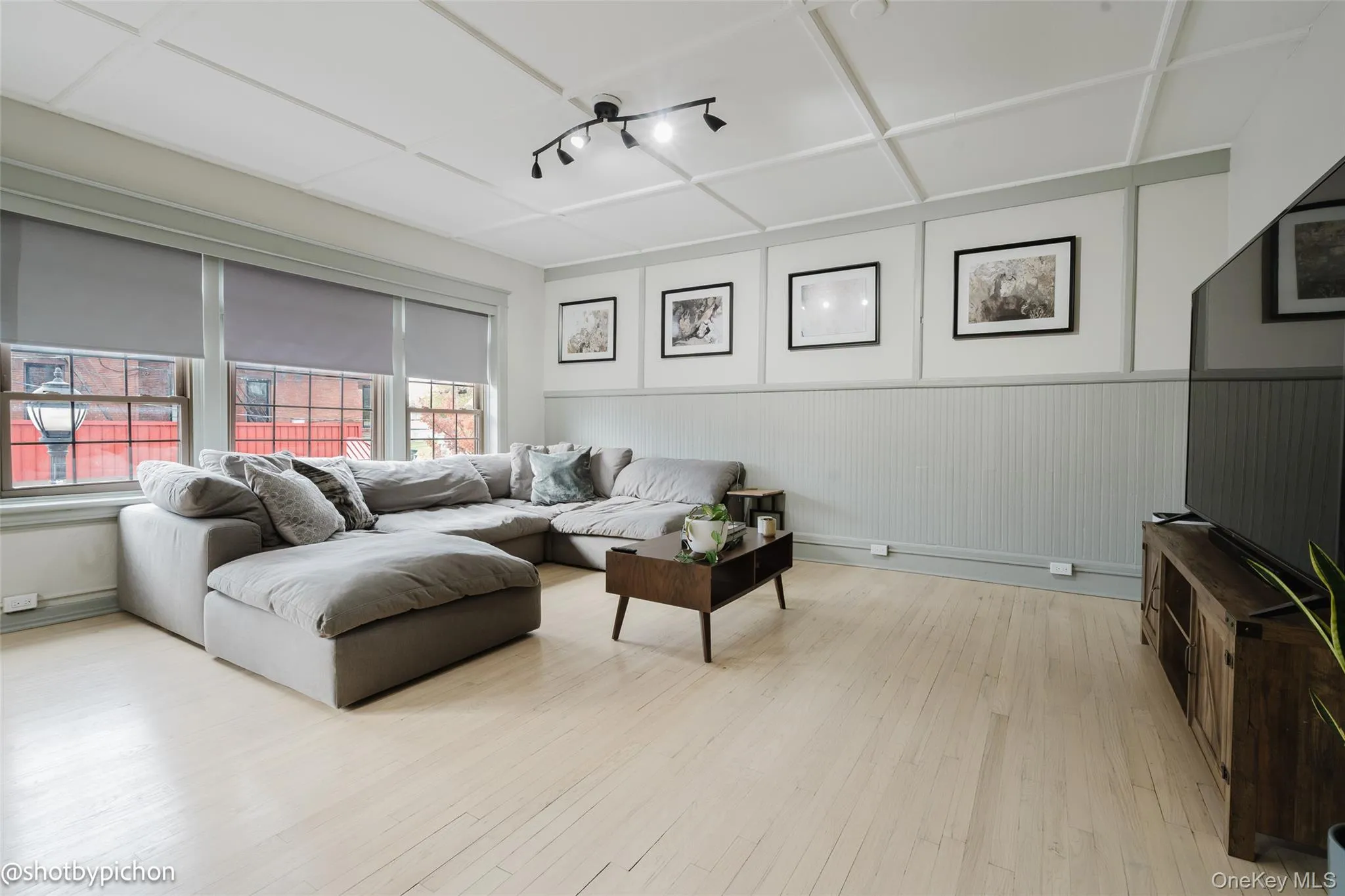 Living area with light wood finished floors Living area with light wood finished floors