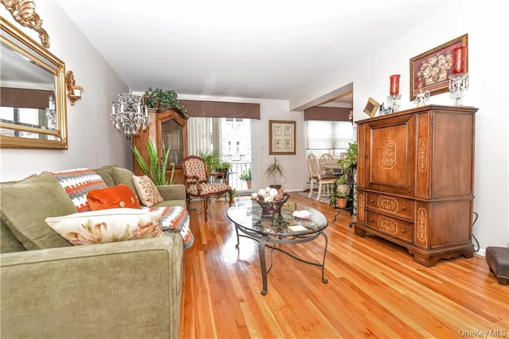 Living room featuring light wood-type flooring and baseboards Living room featuring light wood-type flooring and baseboards