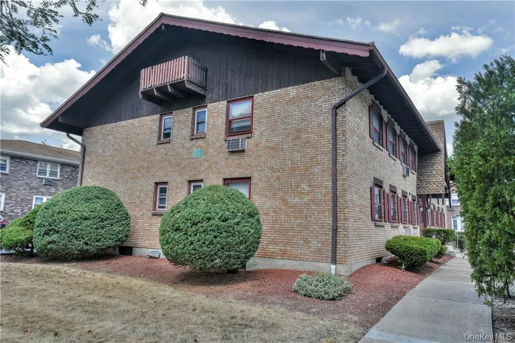 View of side of property with brick siding View of side of property with brick siding