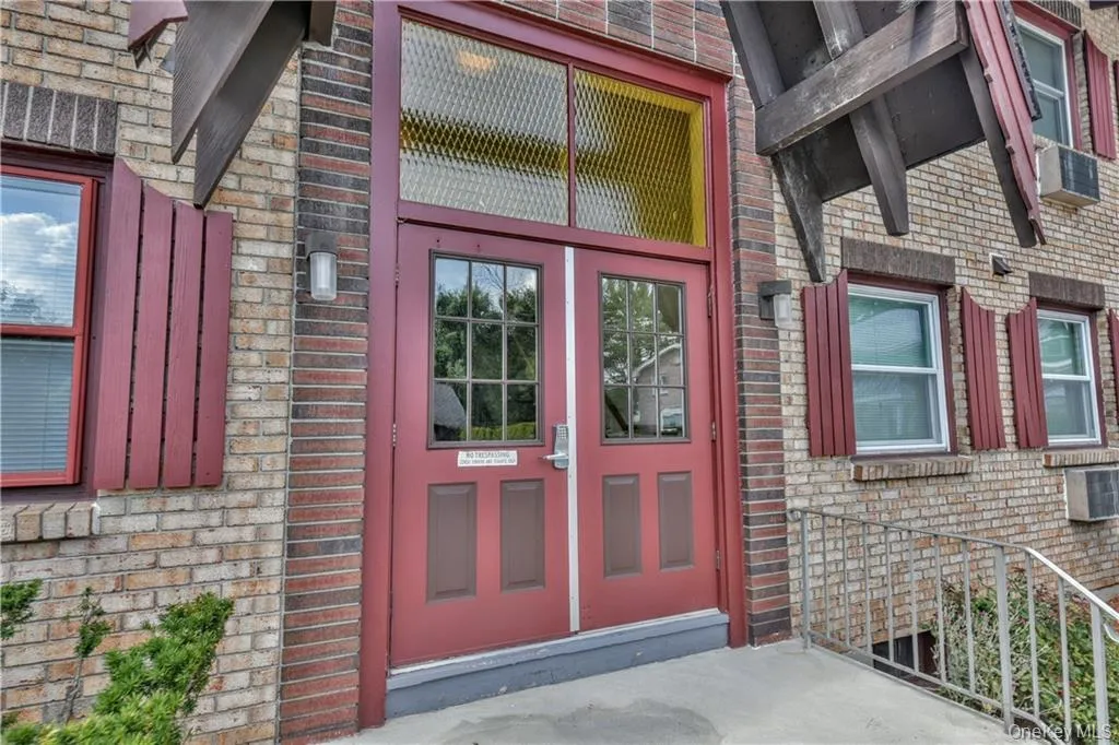 Property entrance with brick siding Property entrance with brick siding