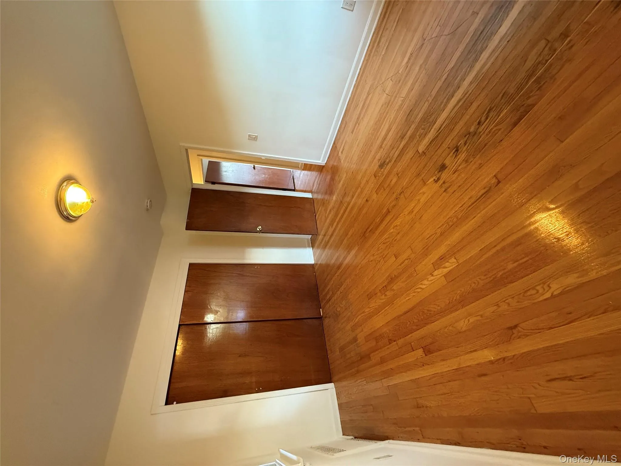 Unfurnished bedroom with light wood-type flooring and a closet Unfurnished bedroom with light wood-type flooring and a closet