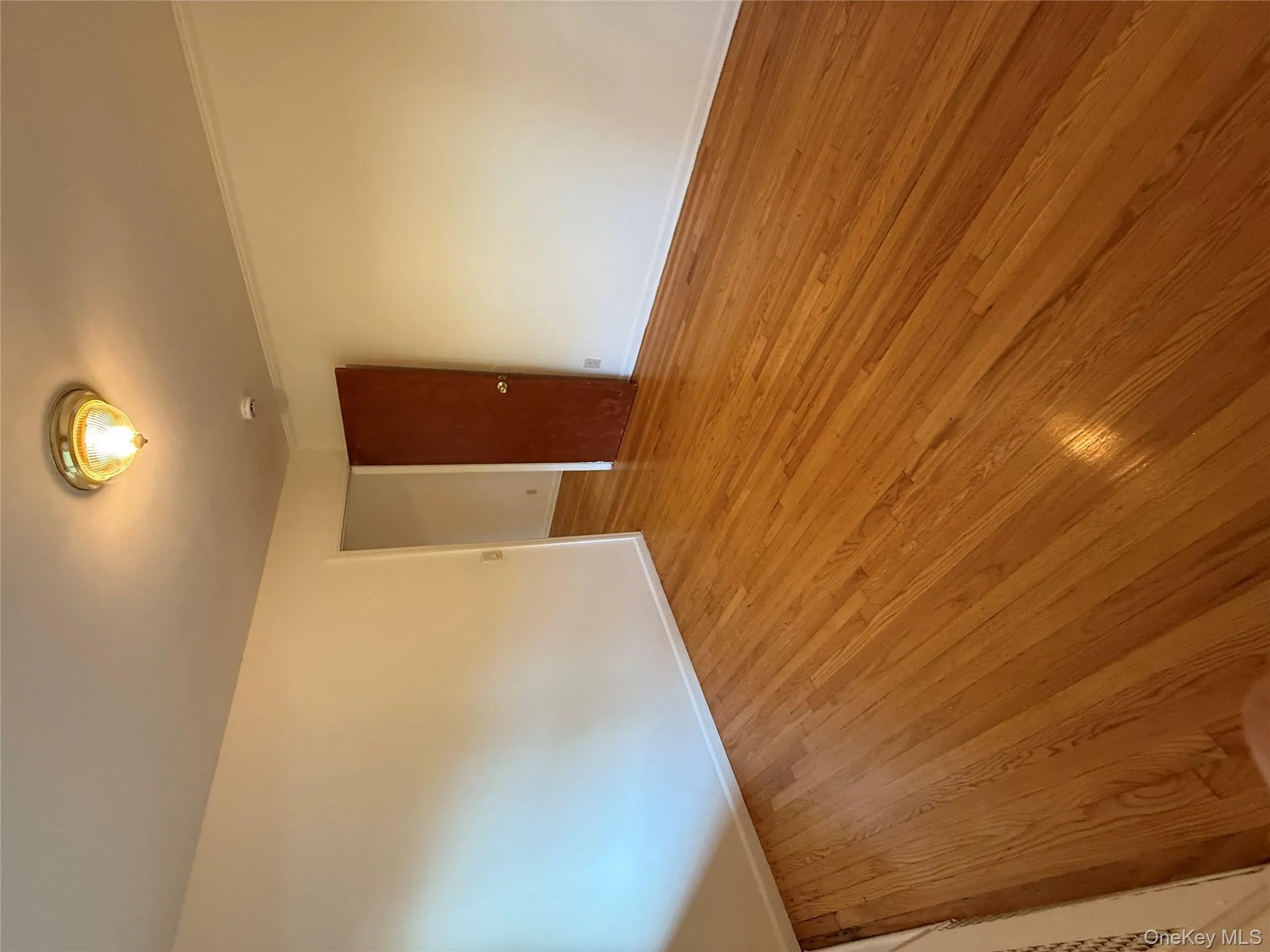 Unfurnished room with wood finished floors Unfurnished room with wood finished floors