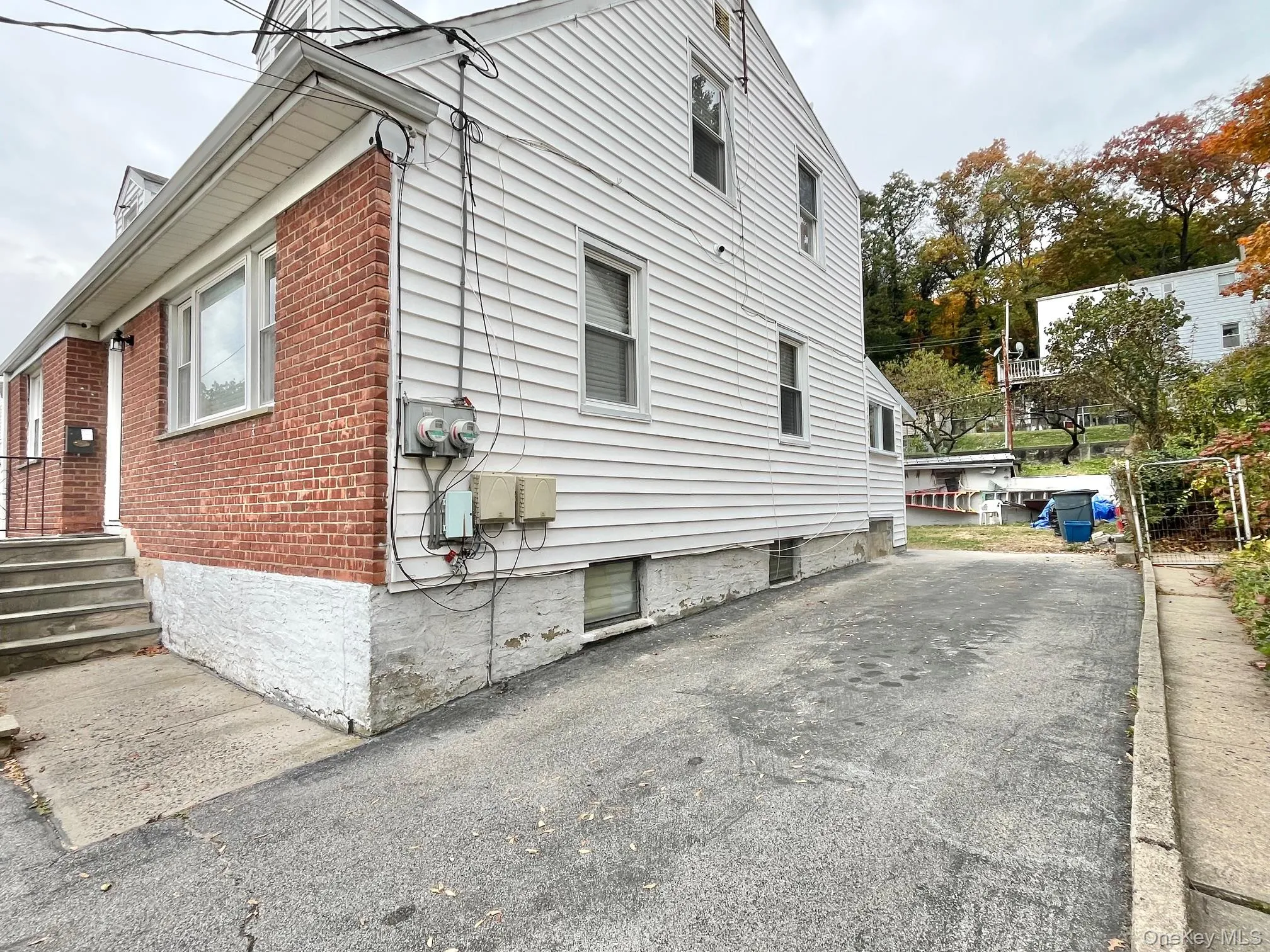 View of side of property with brick siding View of side of property with brick siding