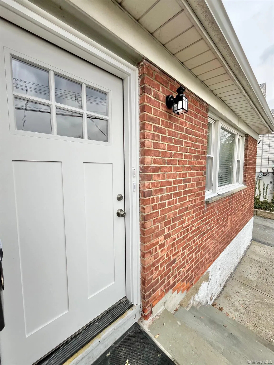 Entrance to property with brick siding Entrance to property with brick siding