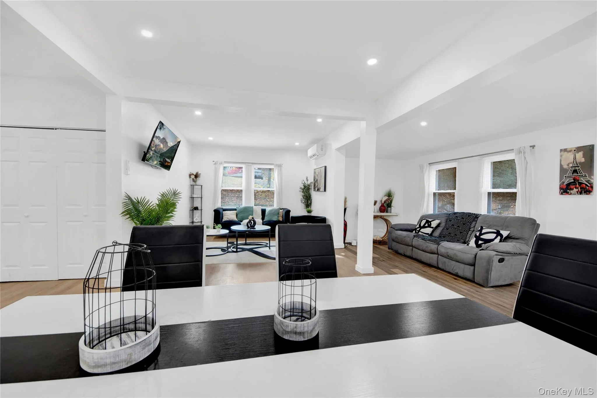Living area featuring light wood finished floors and recessed lighting Living area featuring light wood finished floors and recessed lighting