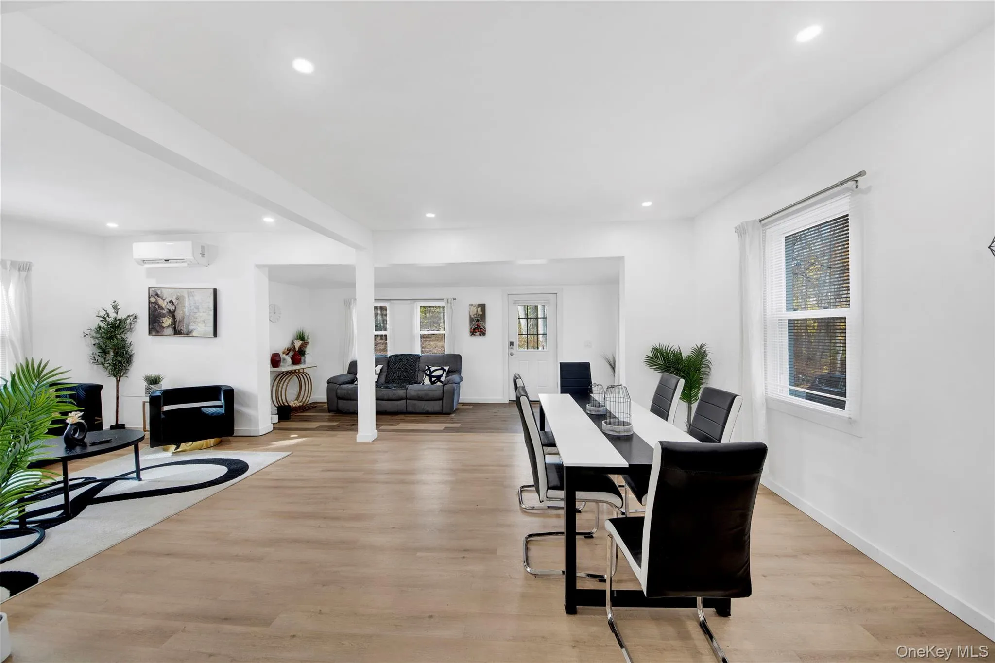 Dining room with recessed lighting, light wood-style flooring, healthy amount of natural light, and french doors Dining room with recessed lighting, light wood-style flooring, healthy amount of natural light, and french doors