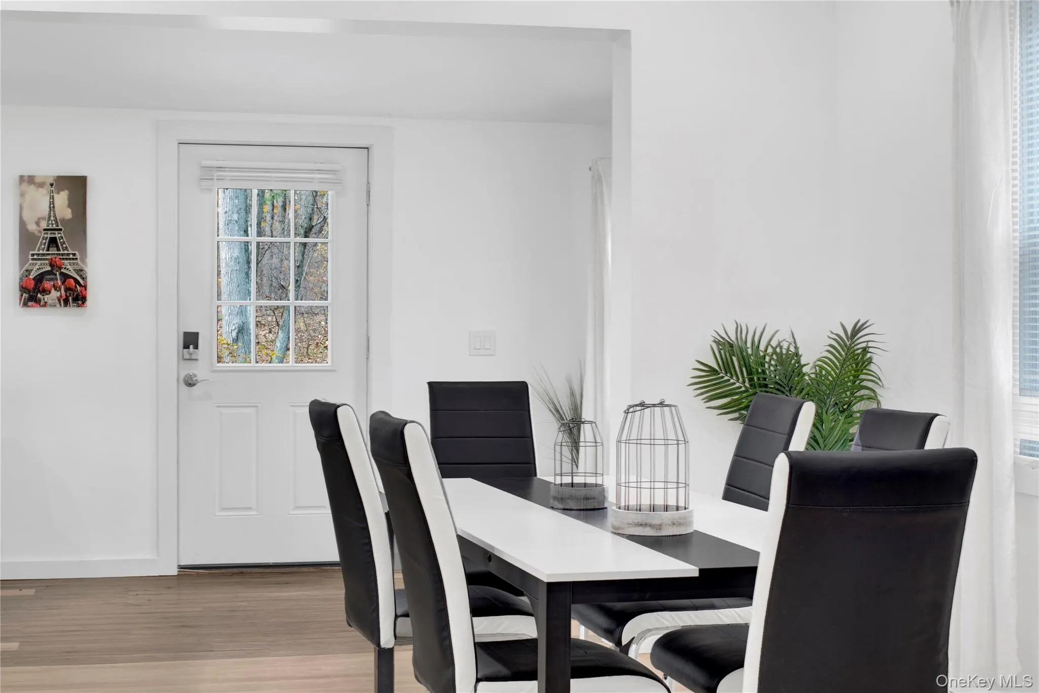 Dining space with light wood-type flooring and baseboards Dining space with light wood-type flooring and baseboards