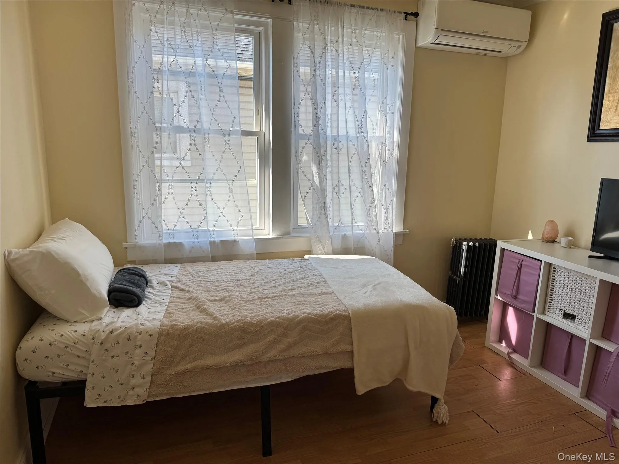 Bedroom featuring light wood-style floors Bedroom featuring light wood-style floors
