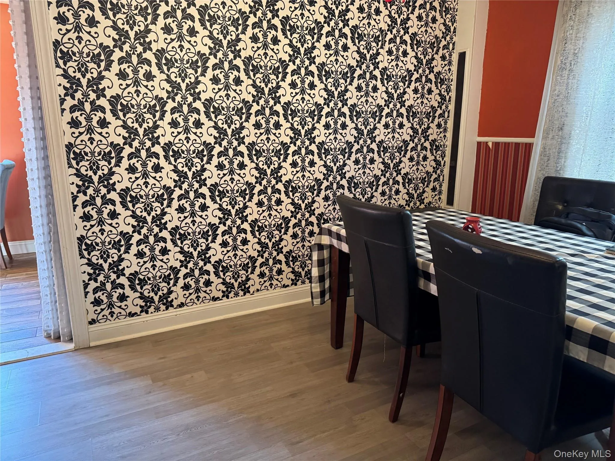 Dining room featuring wood finished floors Dining room featuring wood finished floors