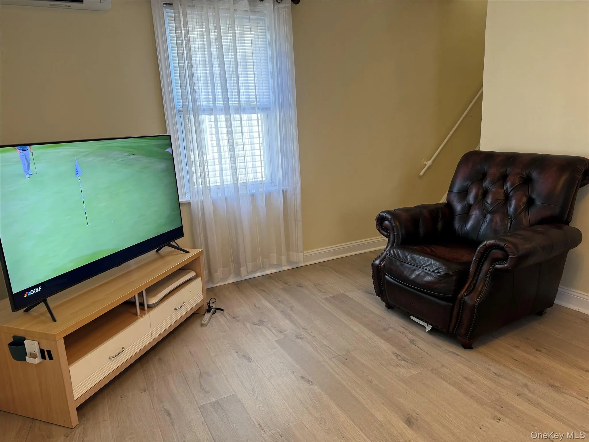 Living area with light wood-style floors Living area with light wood-style floors