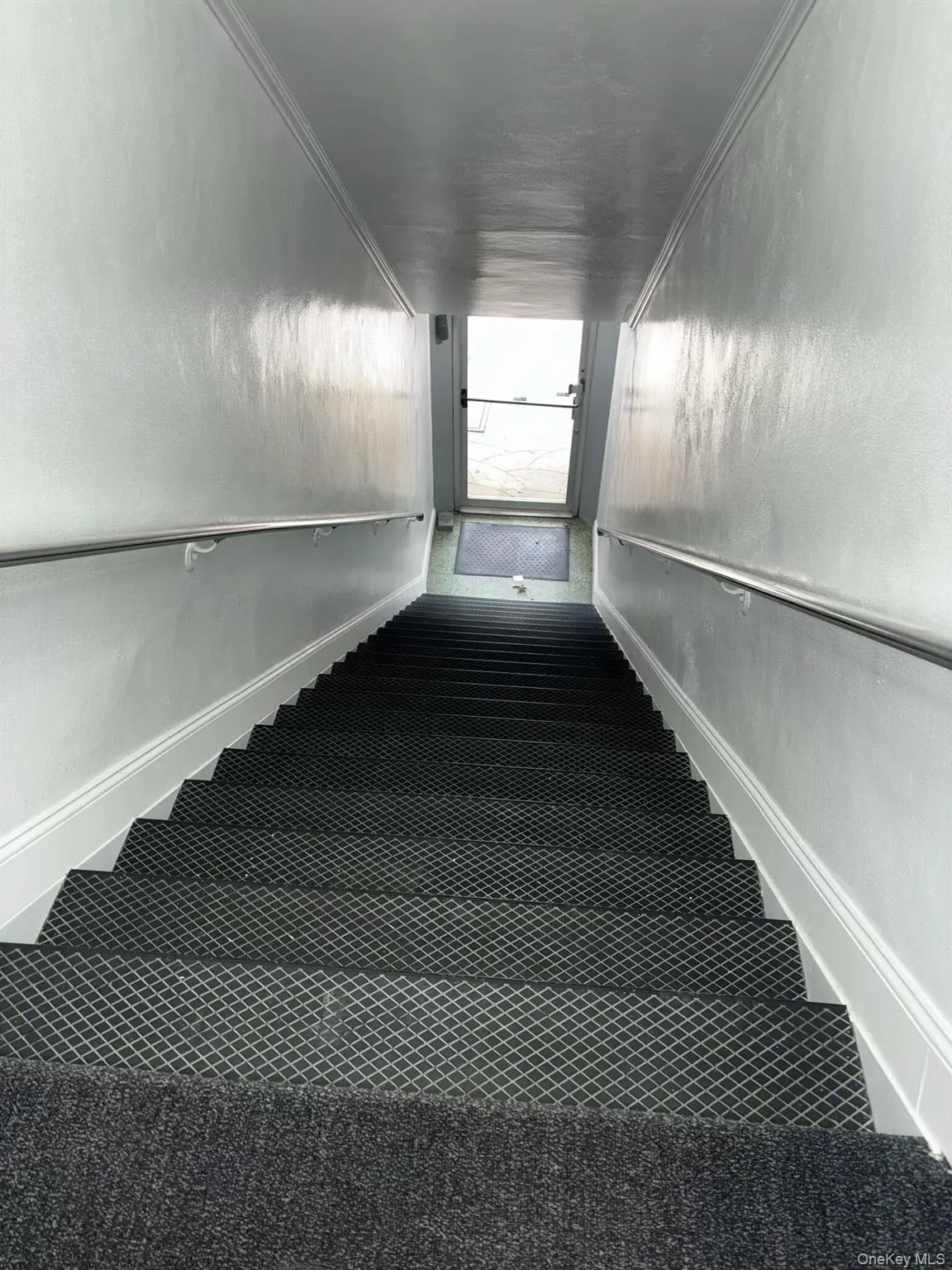 Stairway with baseboards and carpet Stairway with baseboards and carpet