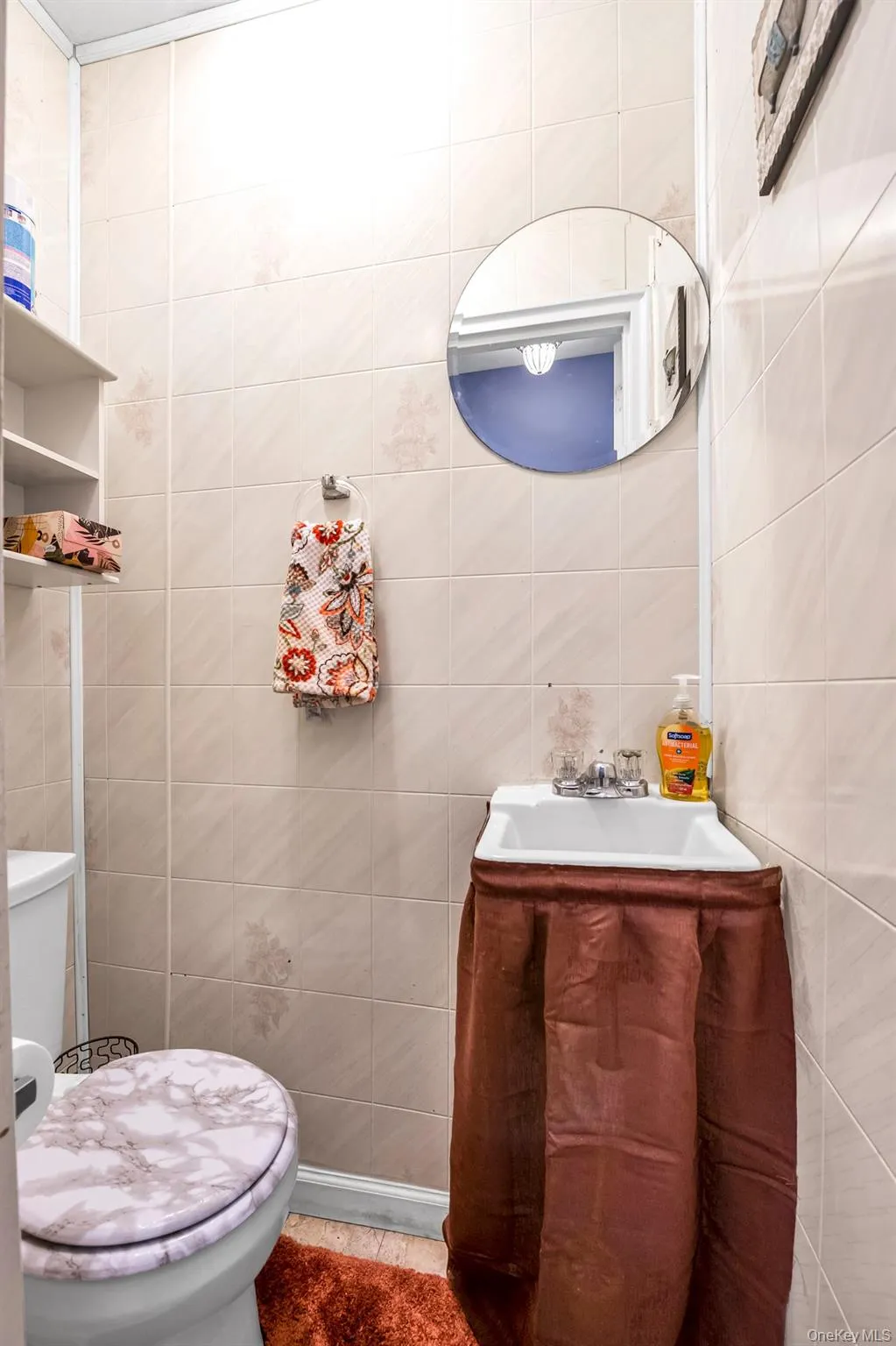 Half bath with tile walls and vanity Half bath with tile walls and vanity