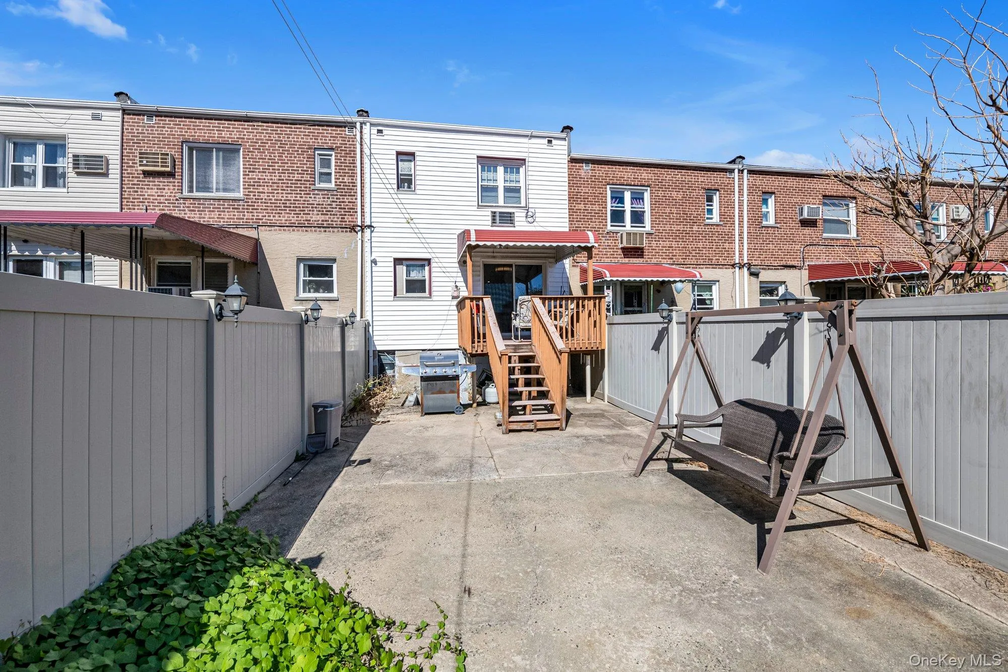 Back of house with a fenced backyard, a residential view, and a patio area Back of house with a fenced backyard, a residential view, and a patio area
